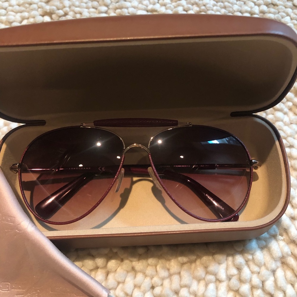 Longchamp Leatherette Wrapped Aviator Sunglasses in gorgeous maroon color.